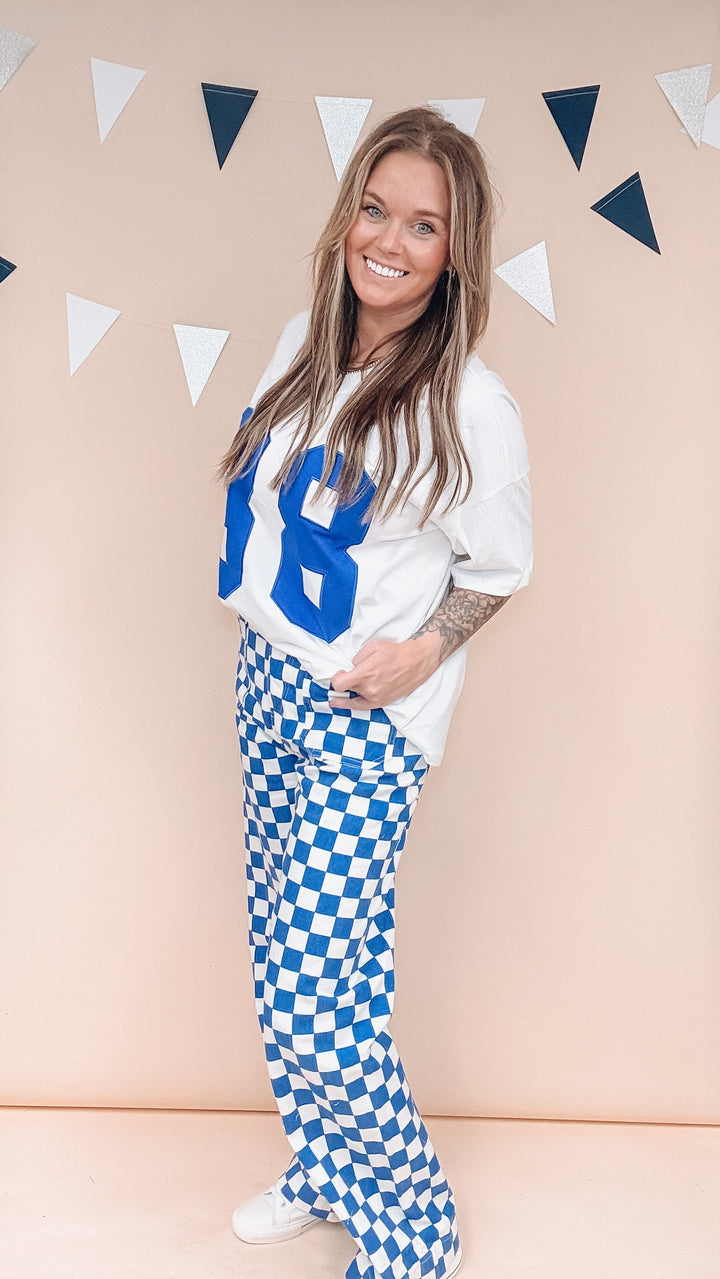 Woman wearing white tee with &