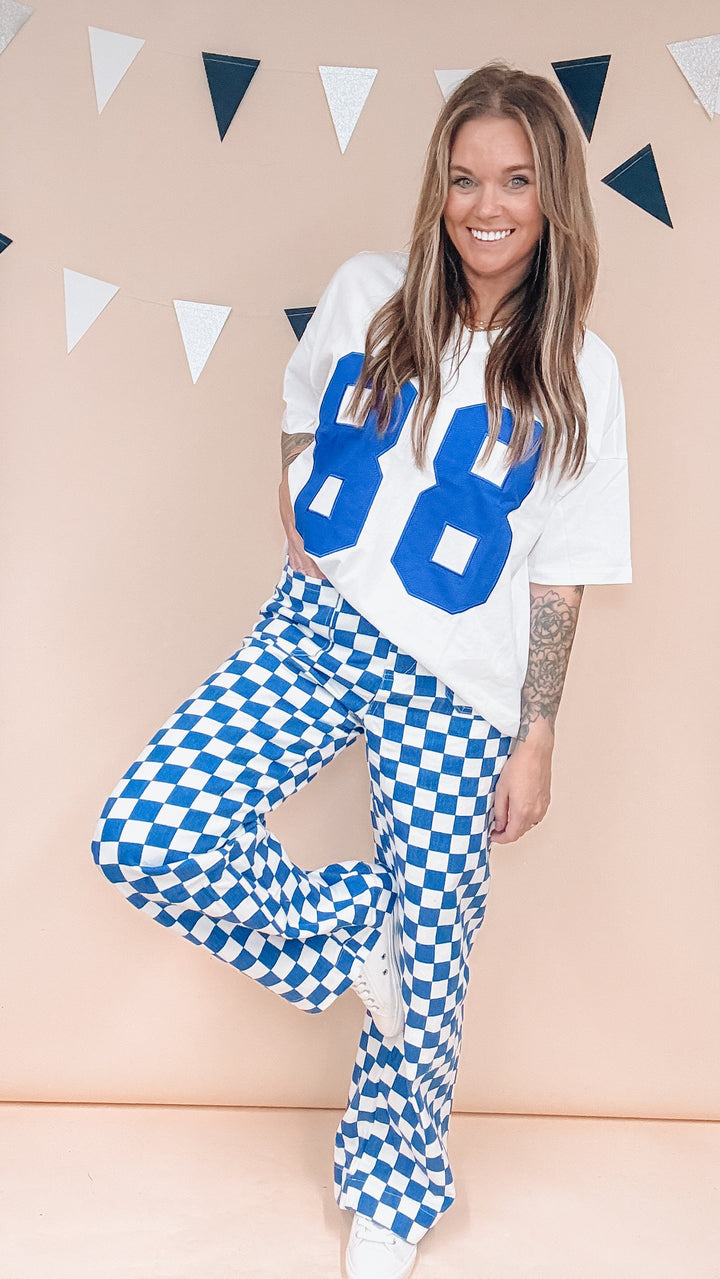 Woman wearing white tee with &