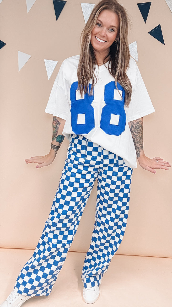 Woman wearing white tee with &
