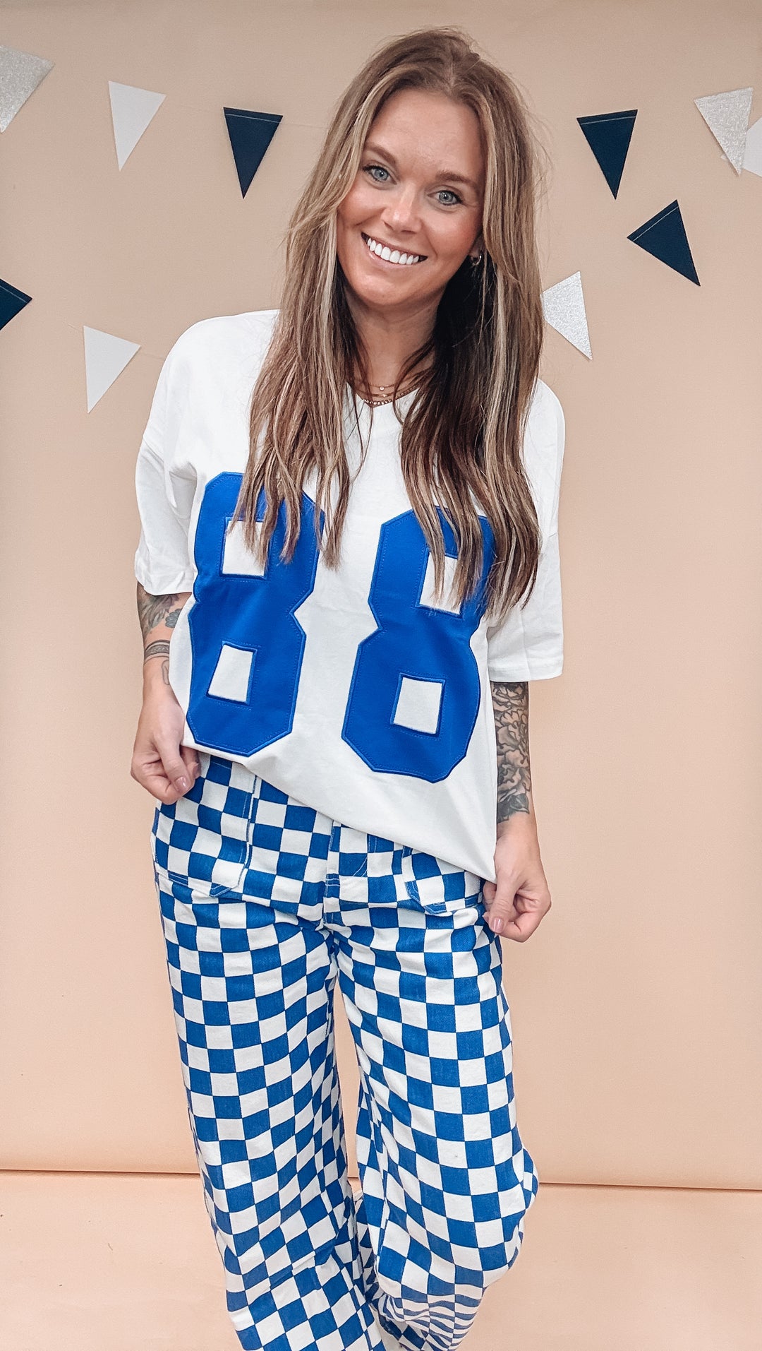 Woman wearing white tee with &