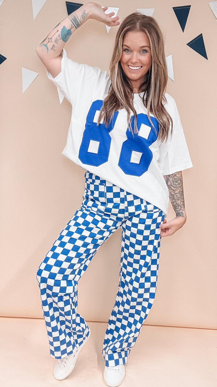 Woman wearing white tee with &