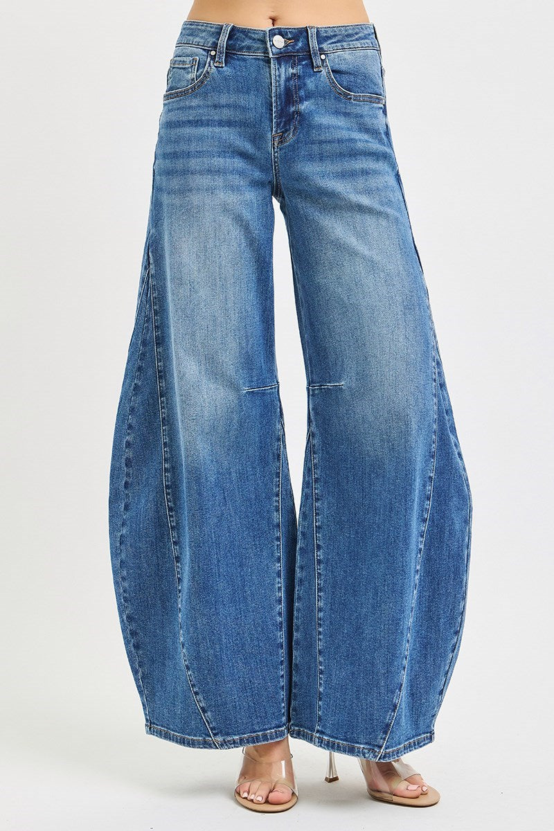 Blue wide-leg jeans on a white background