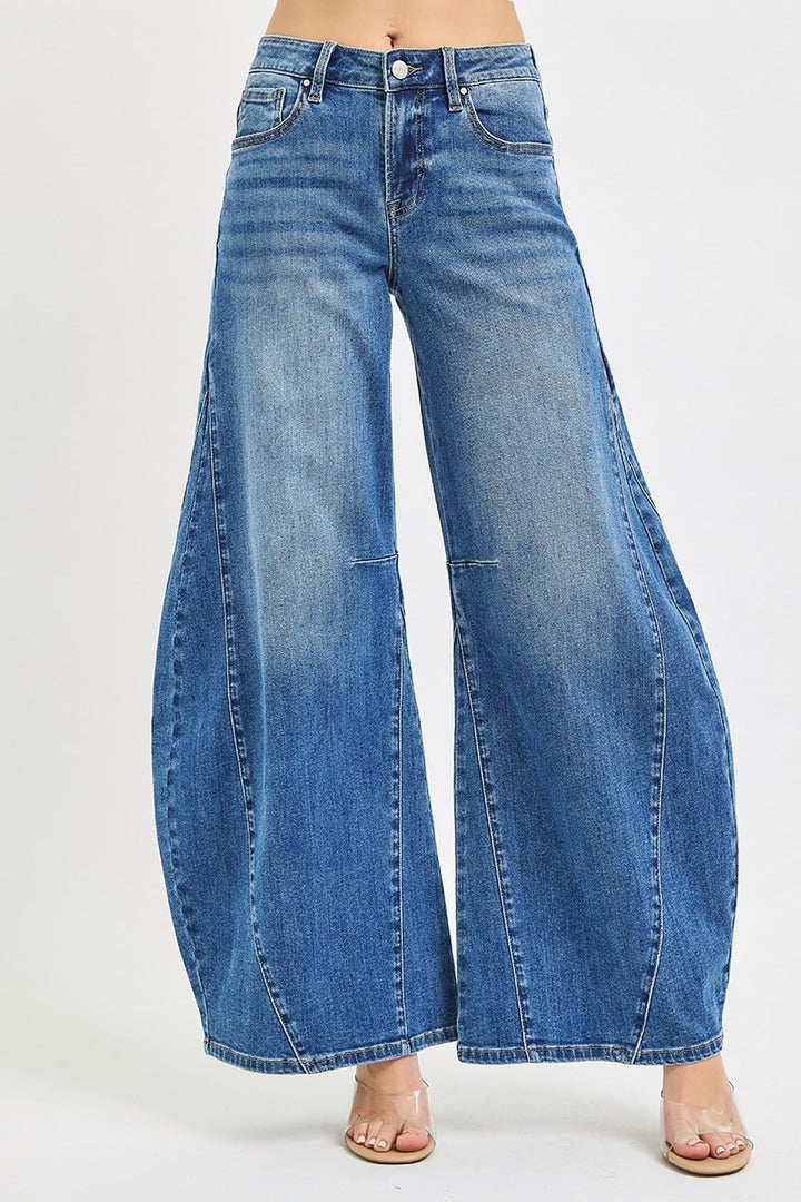 Blue wide-leg jeans on a white background