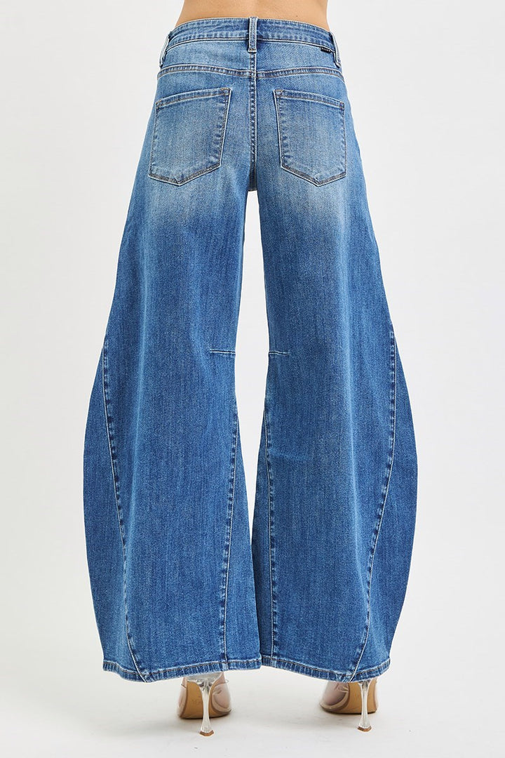 Blue denim wide-leg jeans on a white background