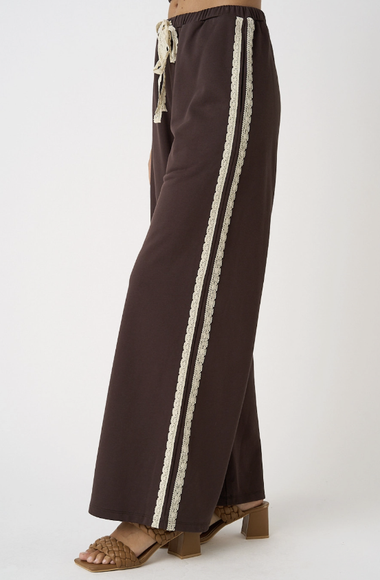 Brown pants with white stripes on a white background