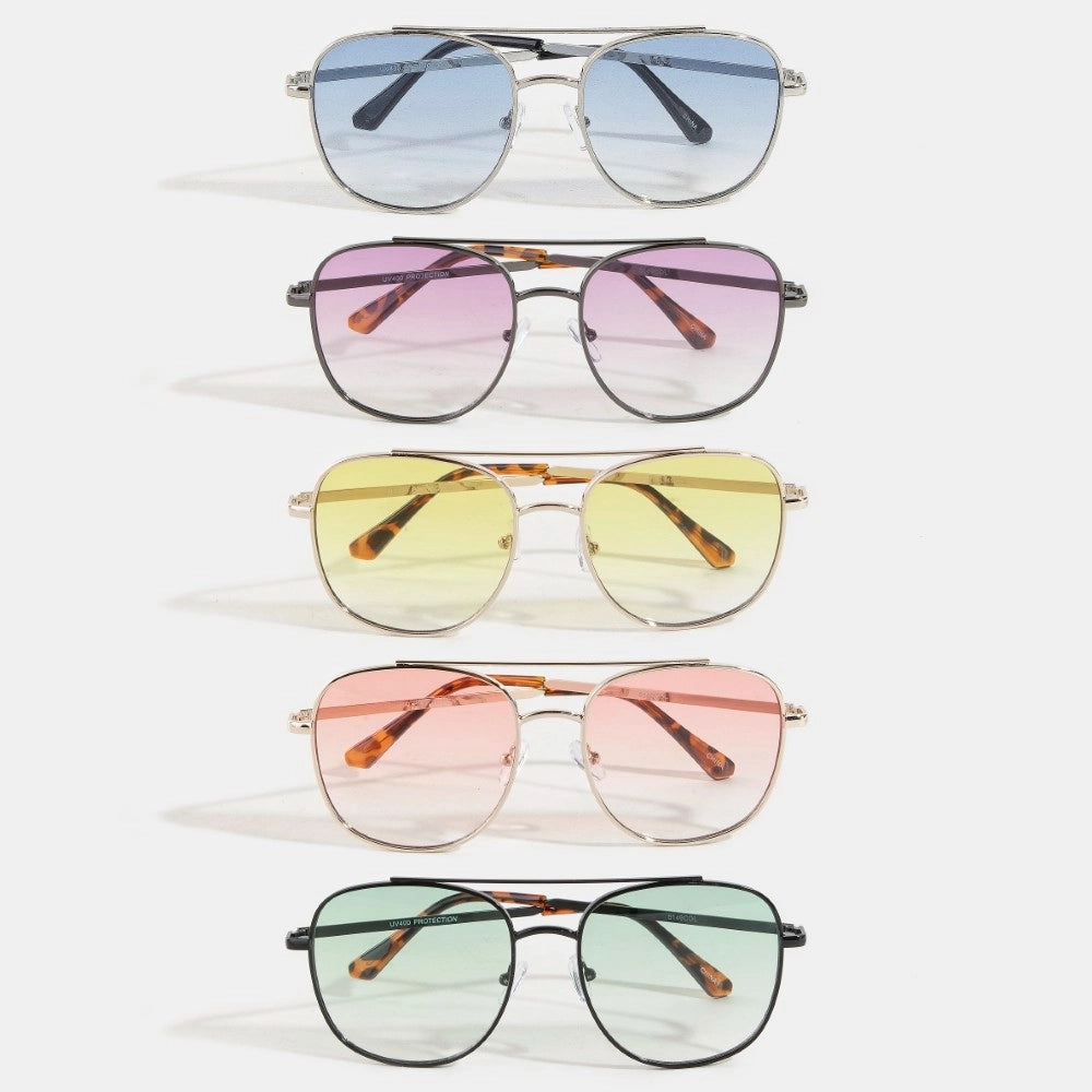 Set of five pairs of sunglasses with gradient lenses on a white background