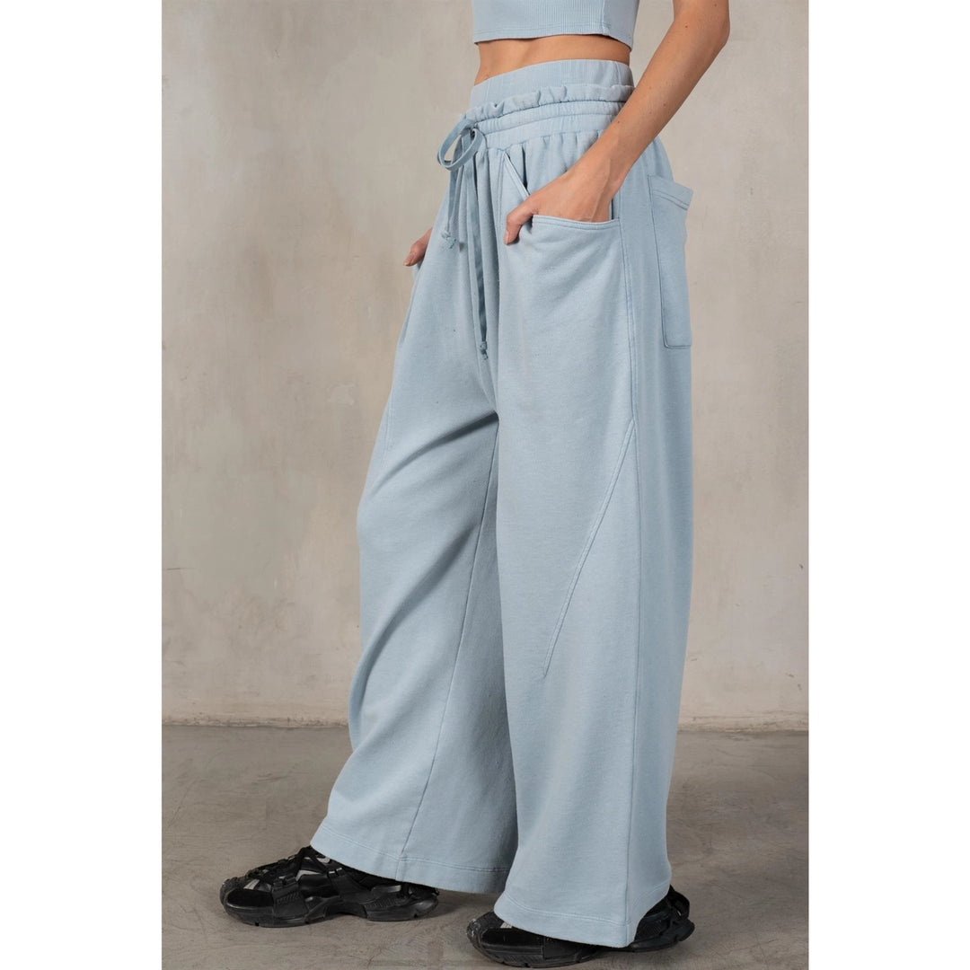 Light blue wide-leg pants worn by a person on a plain background