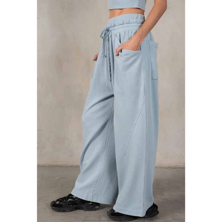 Light blue wide-leg pants worn by a person on a plain background
