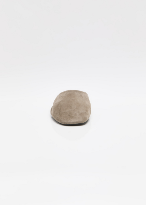 Single beige mule shoe on white background shown from front