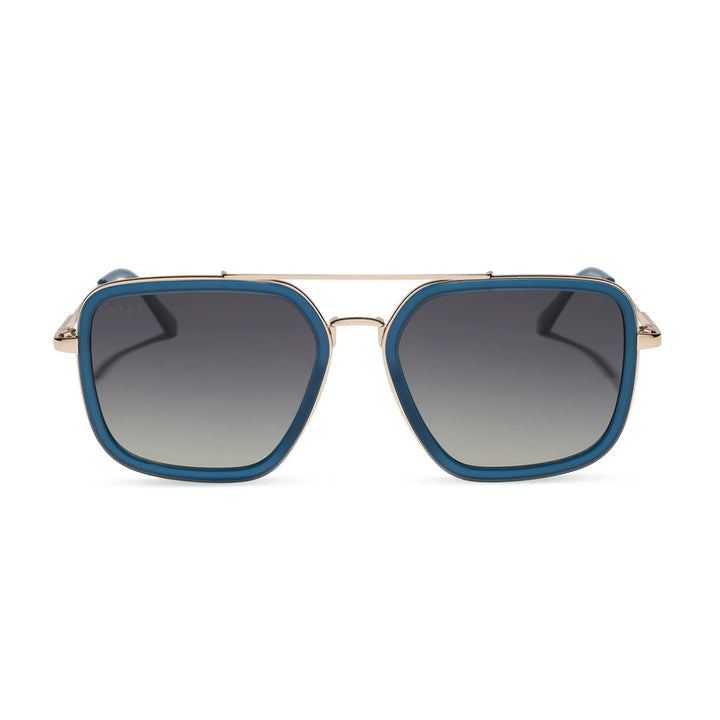Sunglasses with blue frames and gradient lenses on a white background