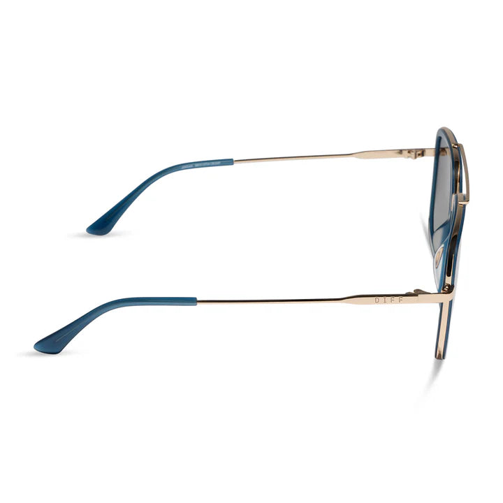 Blue sunglasses with gold arms on white background