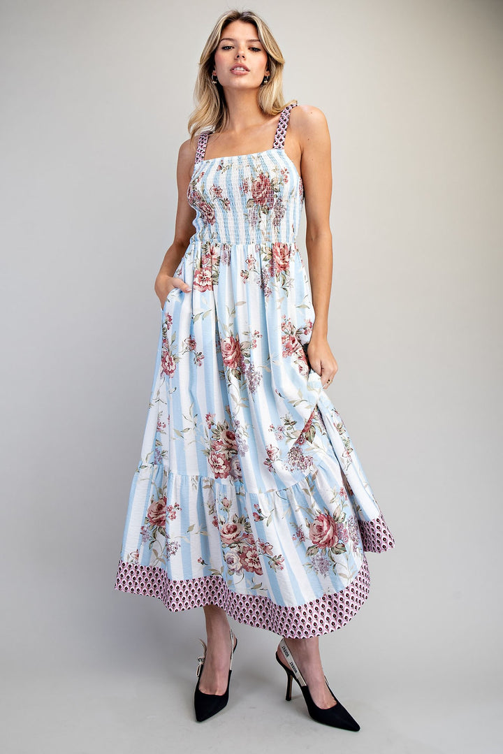 Woman wearing a floral dress with a white background