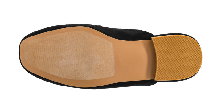 Top-down view of a shoe sole showing a black exterior, tan insole, and textured tan heel section on a white background.