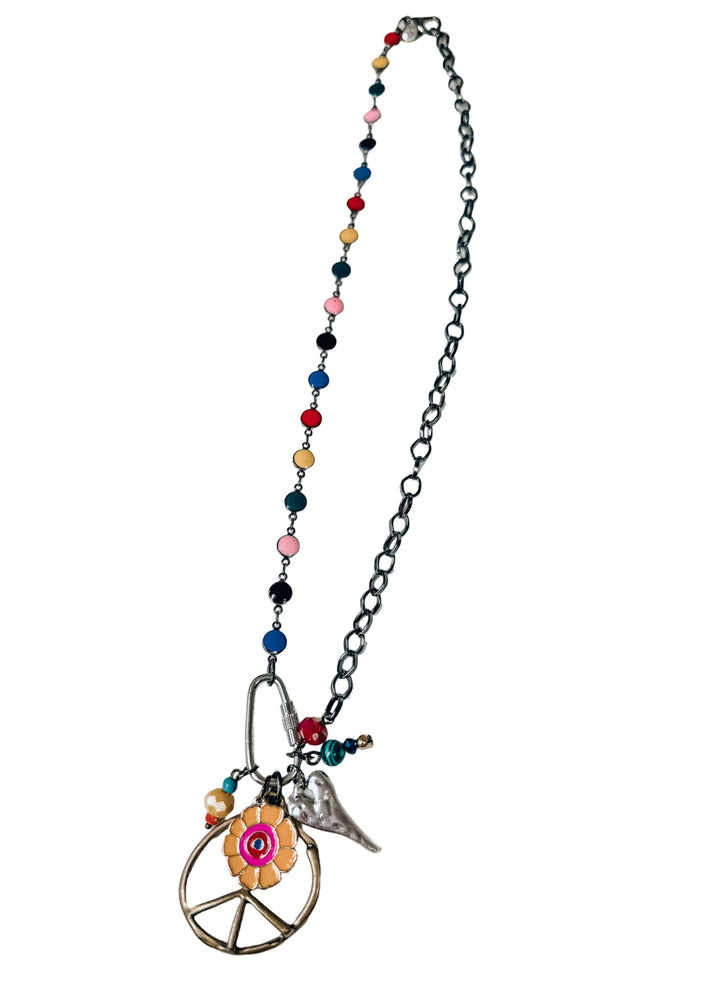 Chain necklace with beads and multiple charms on white background