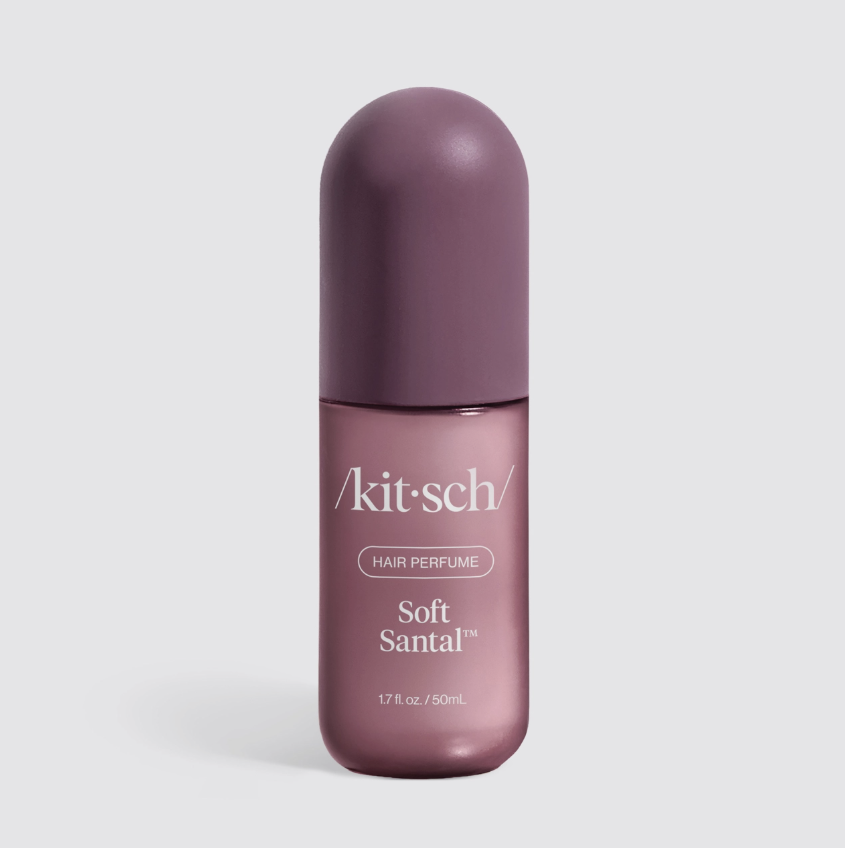 Kitsch hair perfume on white background