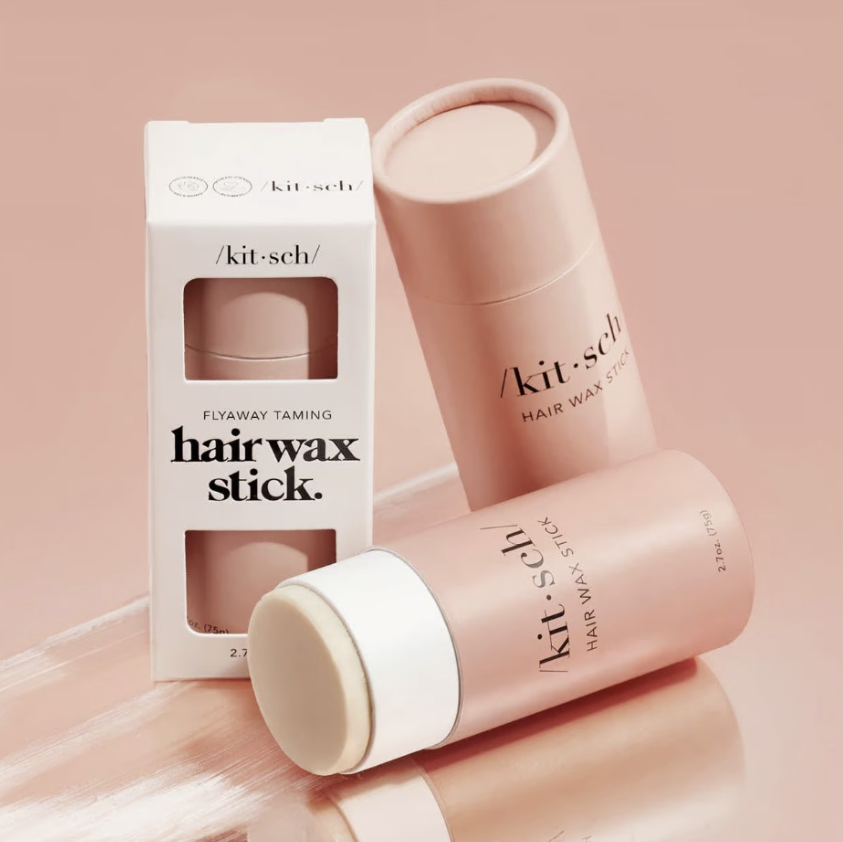 Kitsch hair wax stick in packaging on plain background