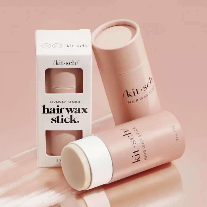 Kitsch hair wax stick in packaging on plain background