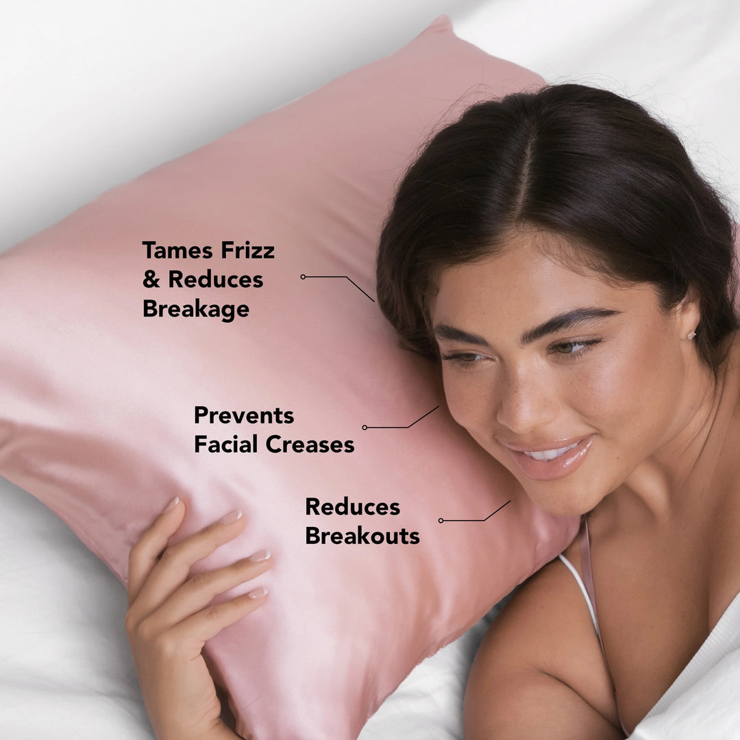 Woman laying on blush satin pillowcase with advertising