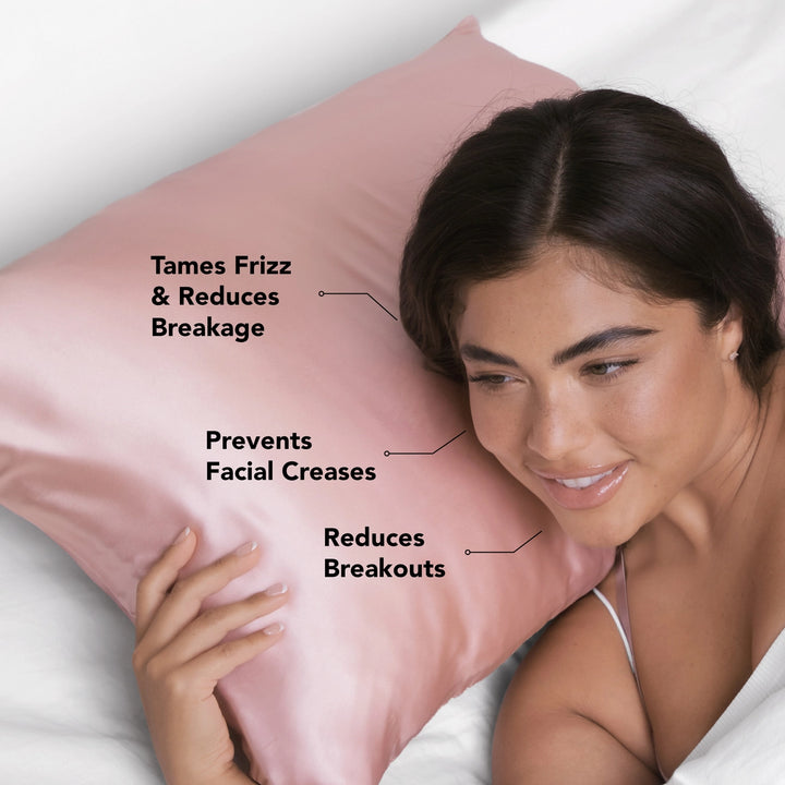 Woman laying on blush satin pillowcase with advertising