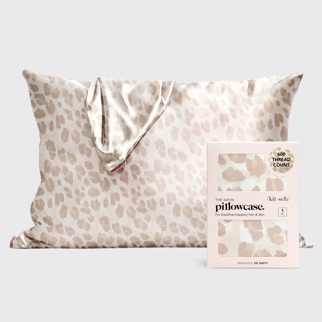 Leopard satin pillowcase on pillow on plain background