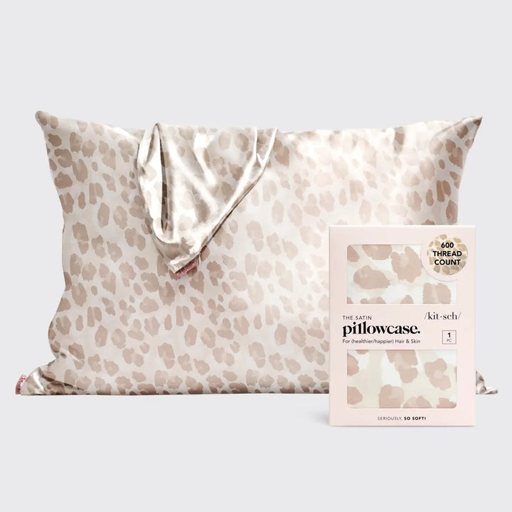 Leopard satin pillowcase on pillow on plain background