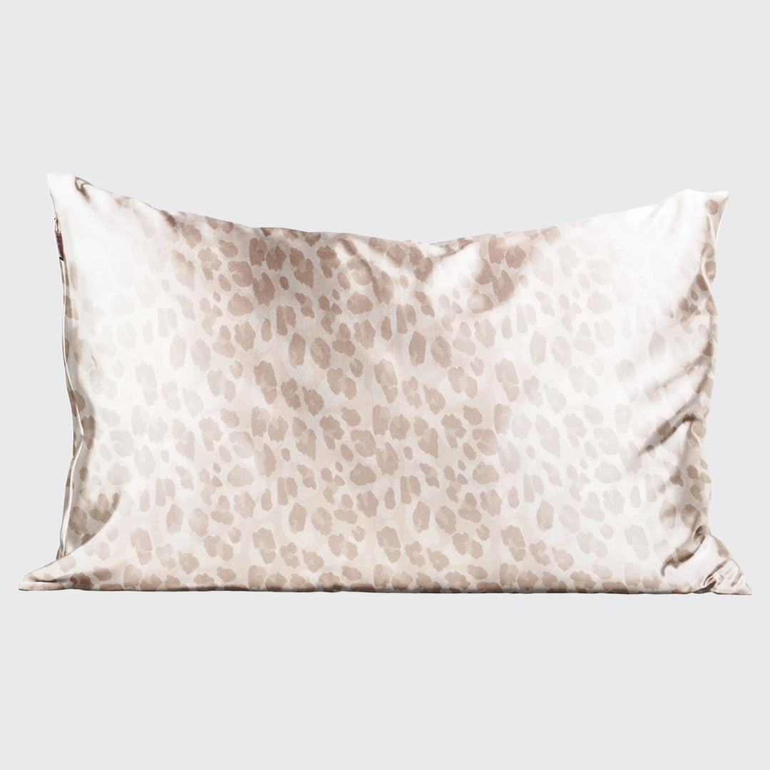 Satin leopard pillowcase on pillow on plain background