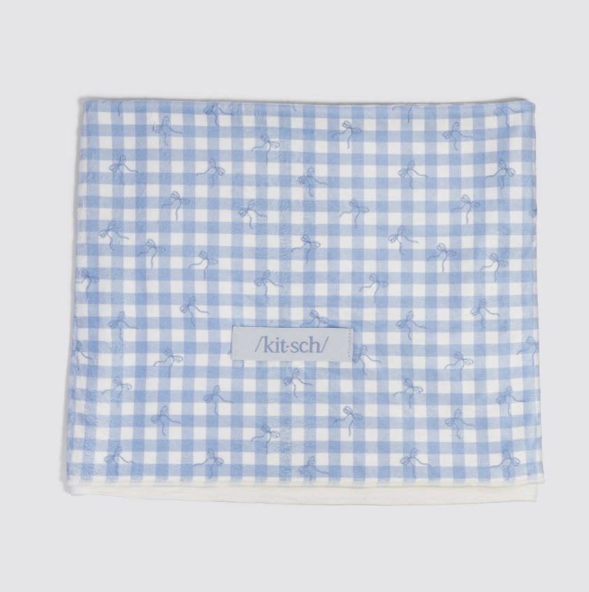 Blue gingham towel on white background