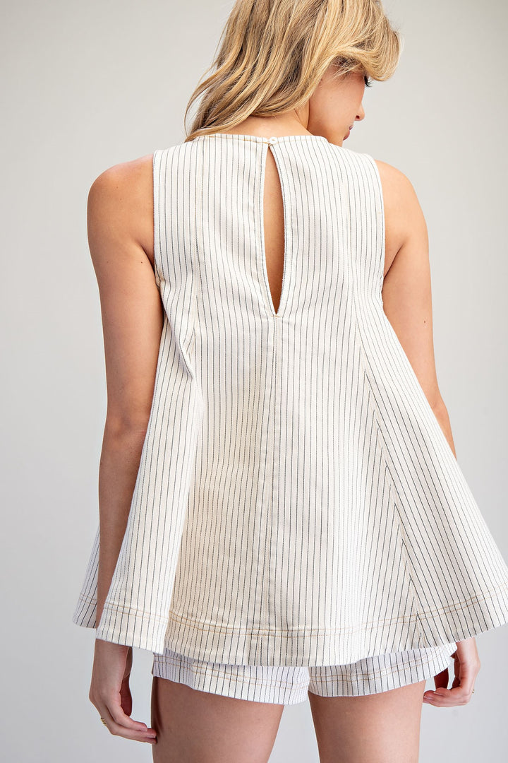 Back of Woman wearing matching stripe set on plain background