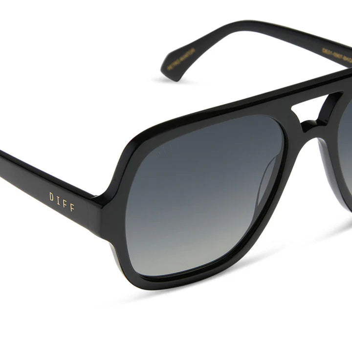 Black sunglasses with gradient lenses on a white background