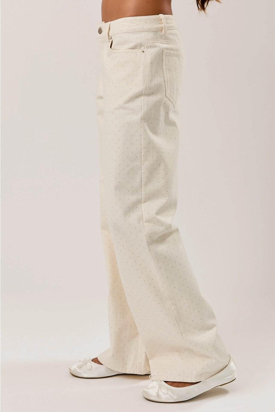 White wide-leg jeans worn by a person on a white background