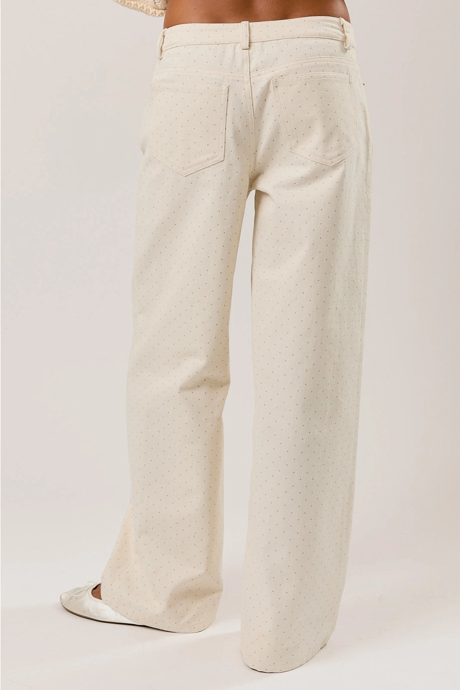 Beige wide-leg pants on a plain background