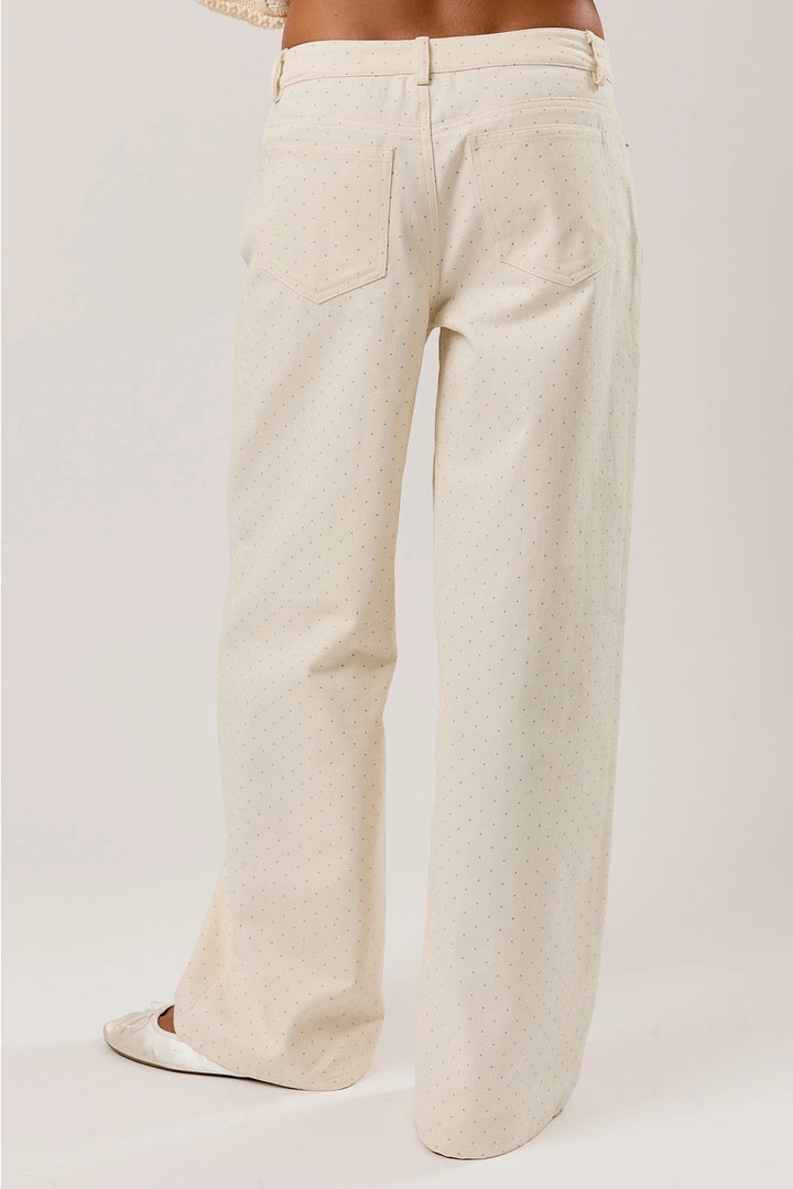 Beige wide-leg pants on a plain background