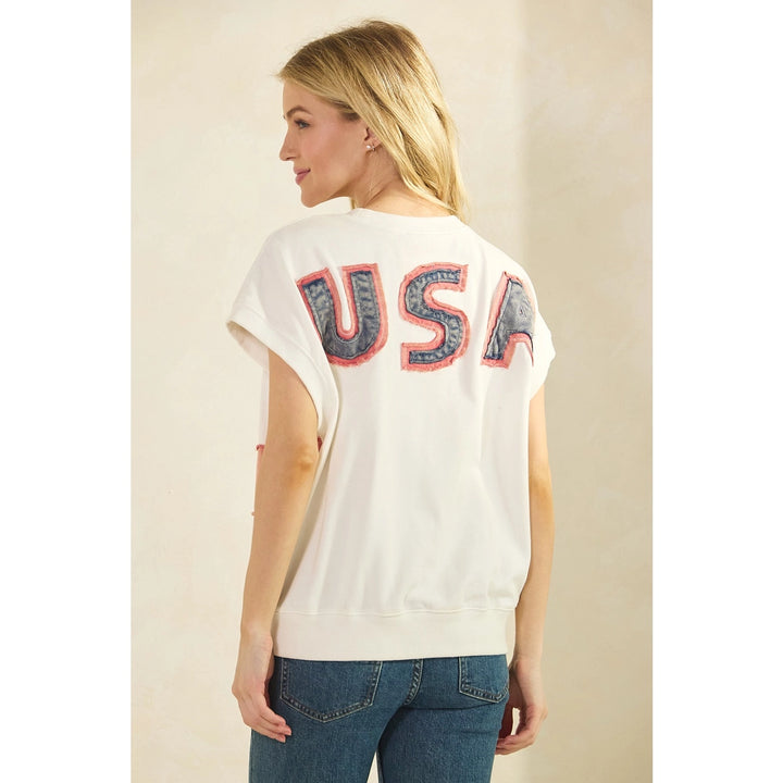 Woman wearing a white t-shirt with &
