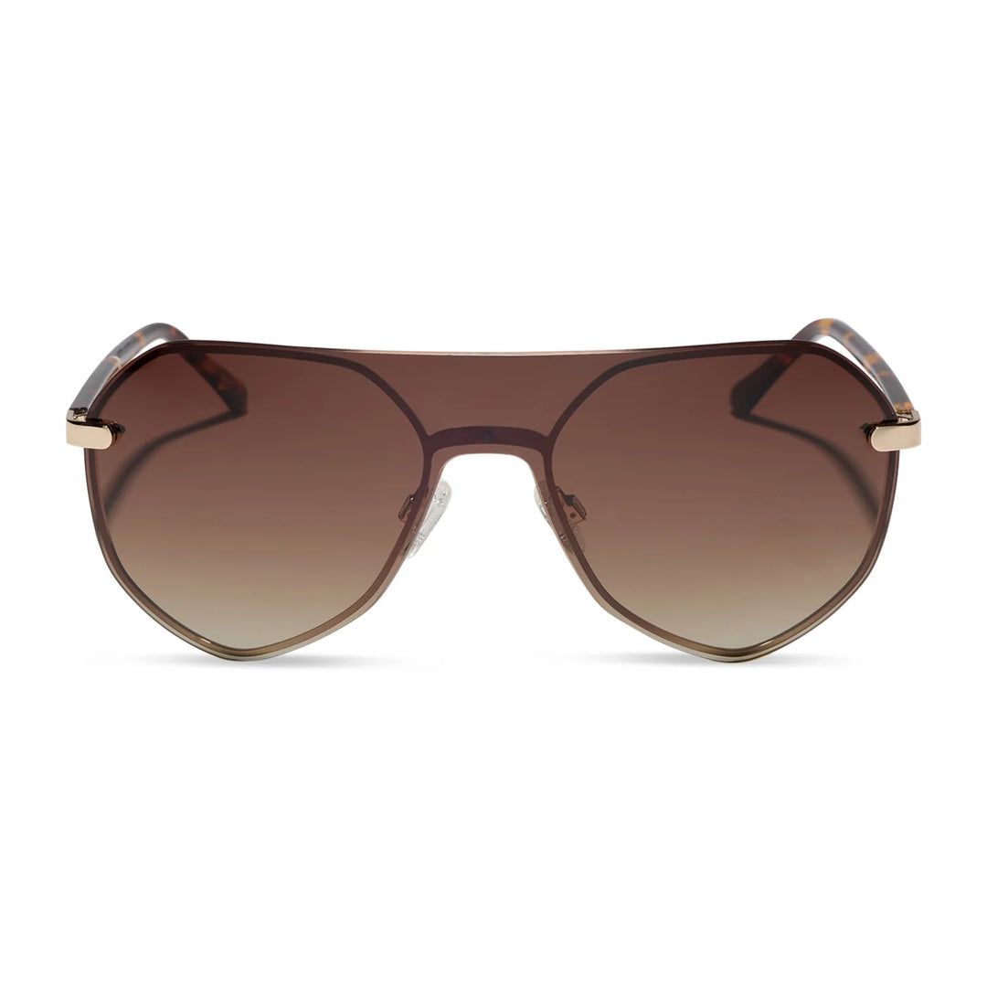 A pair of oversized shield-style sunglasses with gradient brown lenses and gold metal frames, shown against a plain white background.