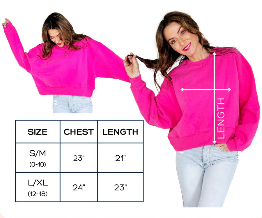 Pink crop sweatshirt with size chart and measurements on a white background