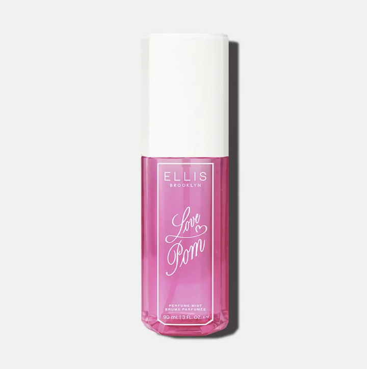 Ellis Brooklyn Love Pom Perfume Oil in a clear rectangular bottle showing pink liquid inside, with a white cylindrical cap, on a light gray background.
