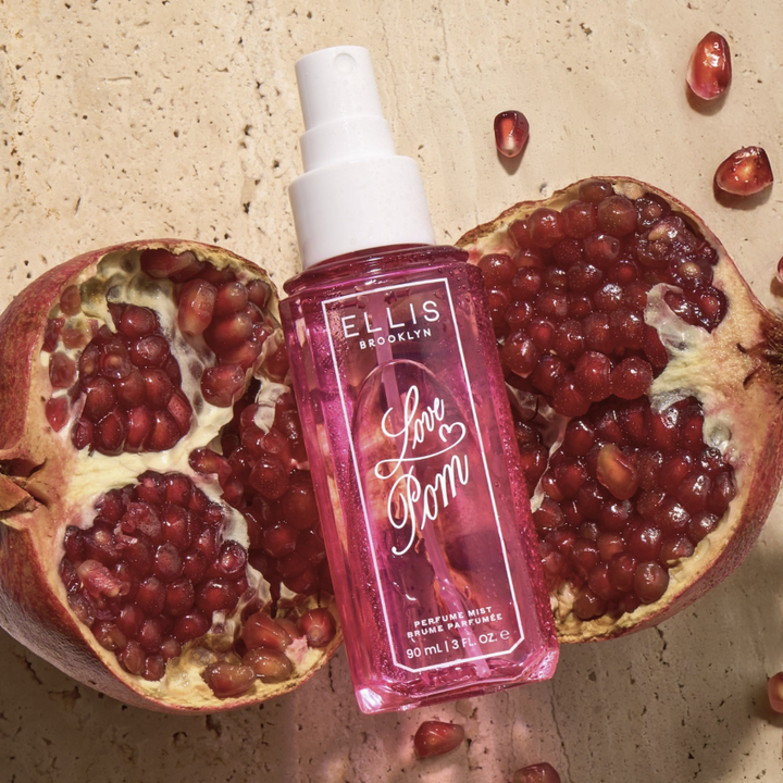 A pink spray bottle labeled &
