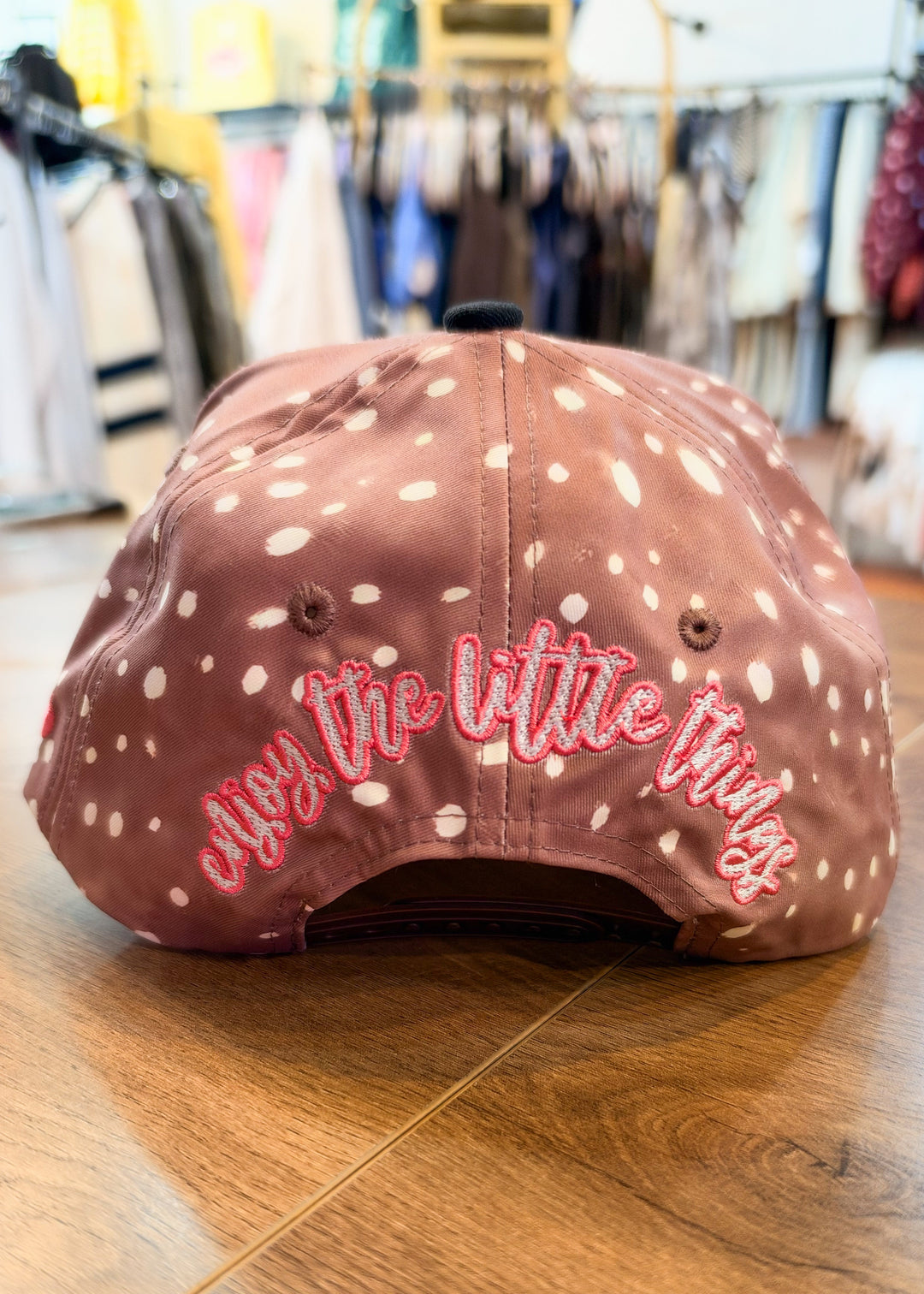 Back of brown polka dot trucker hat with &