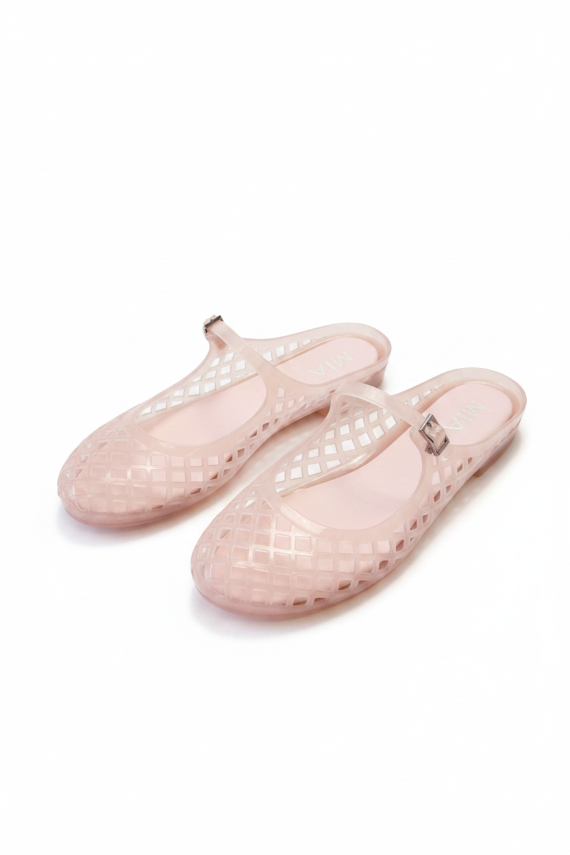 A pair of light pink jelly slip-on shoes on white background