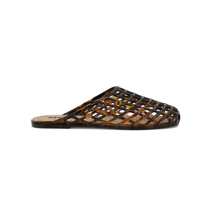 Tortoise colored jelly shoe with cork footbed on white background