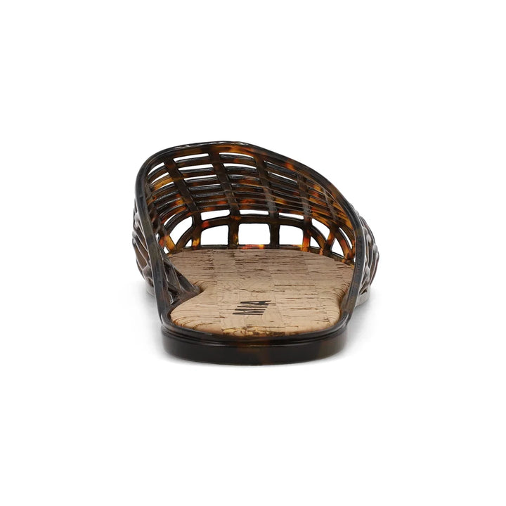 Tortoise jelly shoe with cork footbed on white background