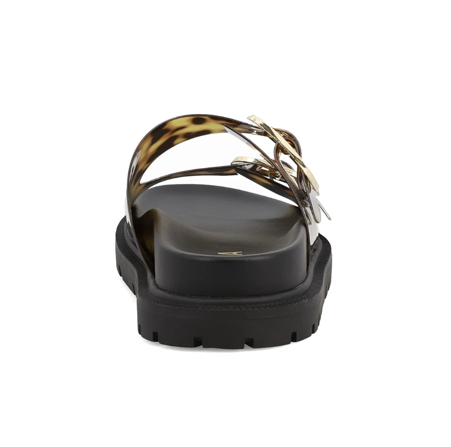 A single black platform sandal with a chunky lug sole, featuring a wide black footbed and a double strap in a brown and black tortoiseshell pattern with a gold-tone metal buckle.