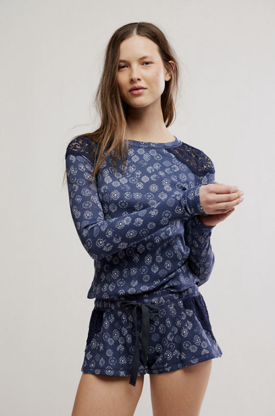 Woman wearing blue patterned shirt on white background