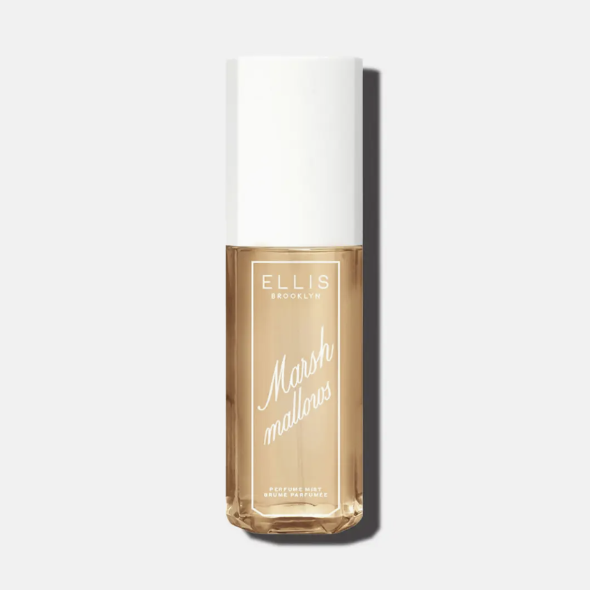 Ellis Brooklyn Marshmallows liquid foundation bottle with a white cap and clear glass showing the golden-beige liquid inside, set against a light gray background with a soft shadow.