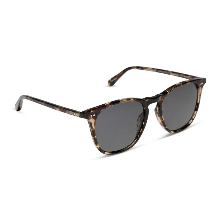 Sunglasses with a pink frame and gradient lenses on a white background
