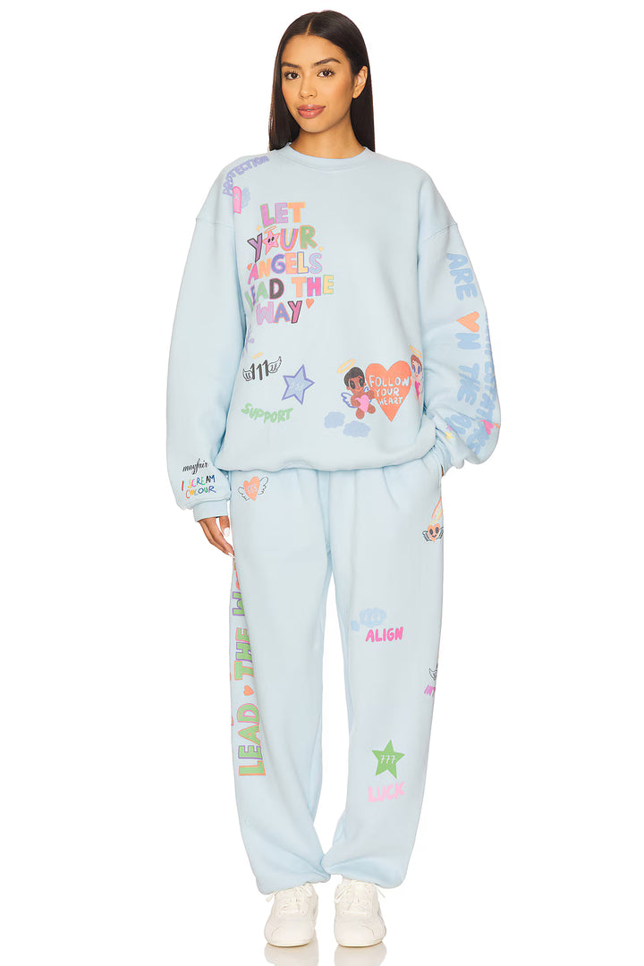 Light blue pajama set with colorful text and graphics on a white background