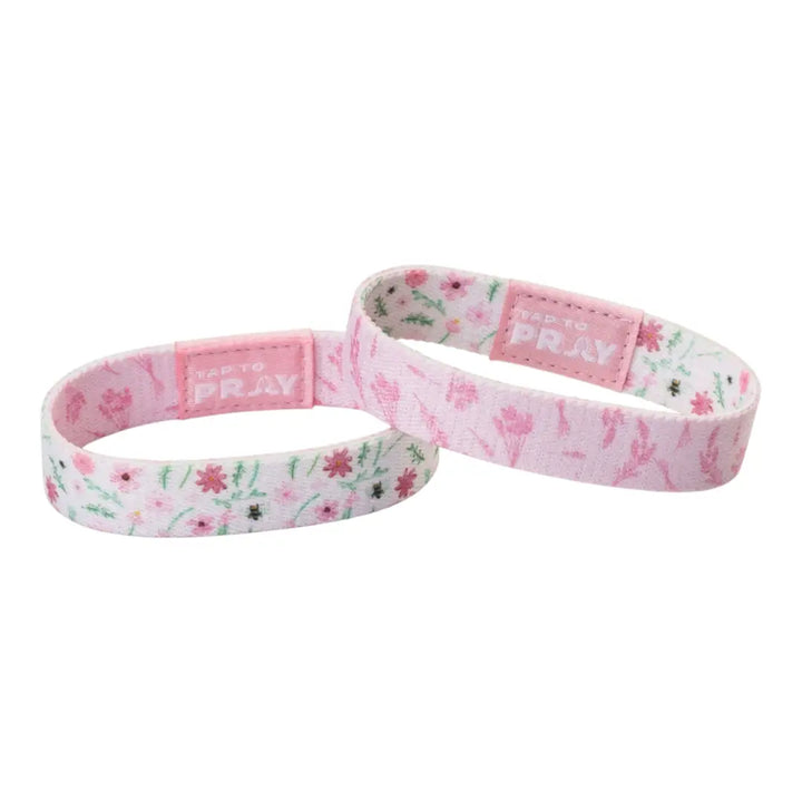 Two pink floral-patterned bands on a white background