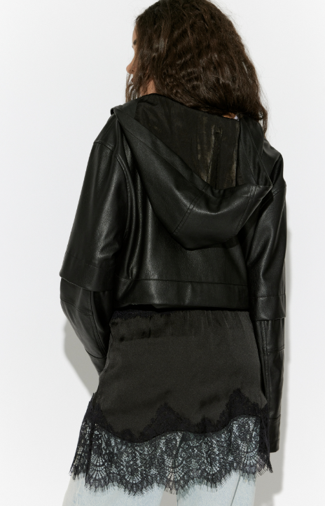Black leather jacket with lace trim worn by a person on a white background