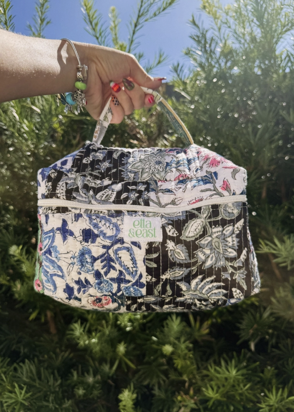 quilted makeup bag with paisley designs outdoors