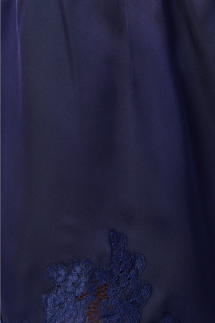 Close up of navy satin shorts with lace trim